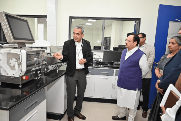 Dr Derajram showing his work to Hon'ble Union Minister